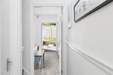 From the front door with the sitting-room on the left, stairs and the ktichen/diner.