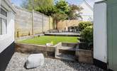 The beautifully maintained rear garden is perfect for al fresco dining and the family dog! - Thumbnail Image