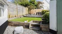 The beautifully maintained rear garden is perfect for al fresco dining and the family dog!