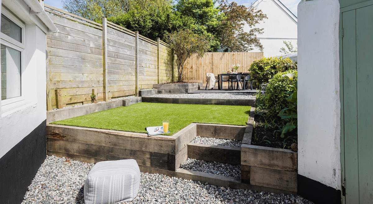 The beautifully maintained rear garden is perfect for al fresco dining and the family dog!