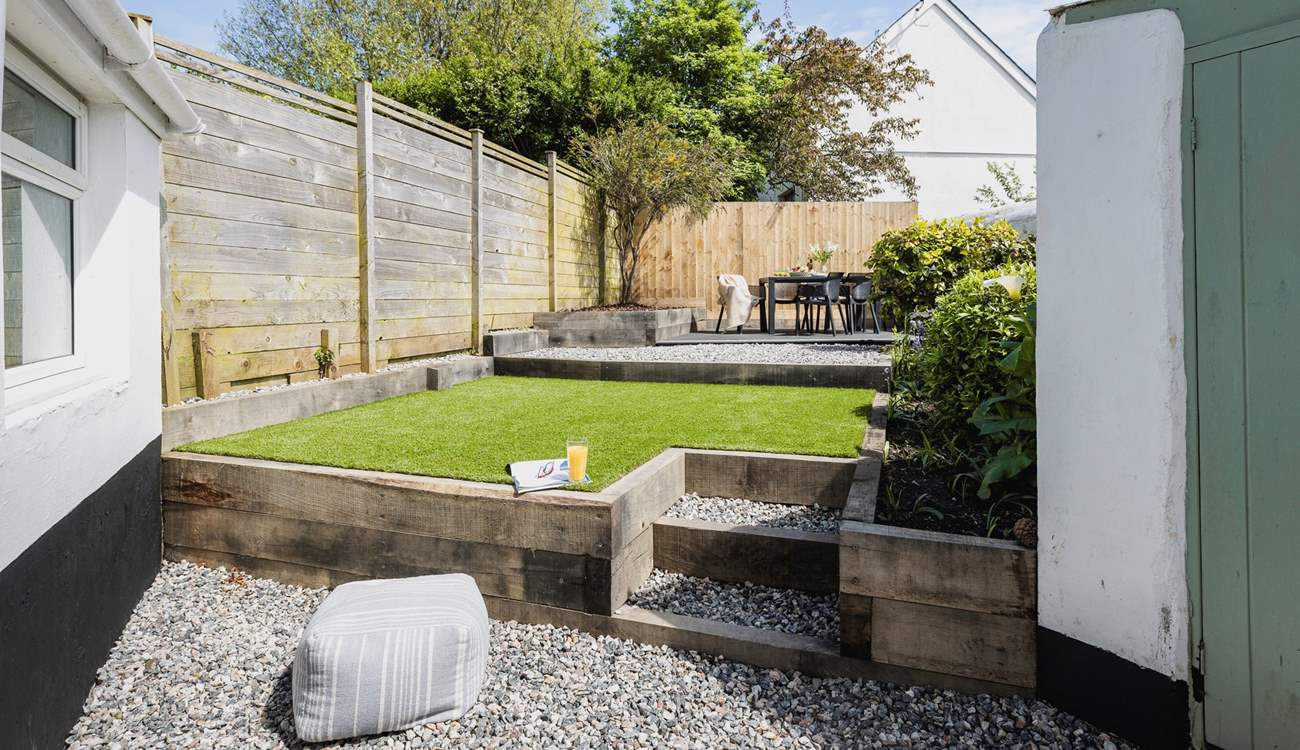 The beautifully maintained rear garden is perfect for al fresco dining and the family dog!
