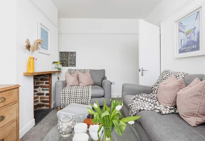 The cosy sitting-room is furnished in relaxing pastel shades.