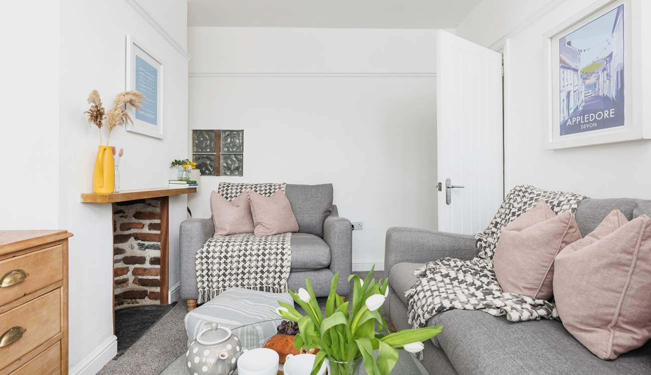 The cosy sitting-room is furnished in relaxing pastel shades.