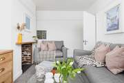 The cosy sitting-room is furnished in relaxing pastel shades.