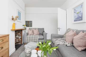 The cosy sitting-room is furnished in relaxing pastel shades.