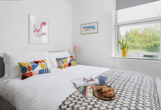 Stylish bedroom 2 looks out over the back of the house and fabulous garden.