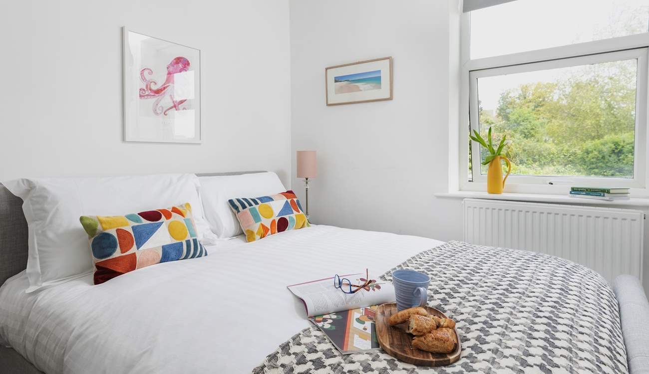 Stylish bedroom 2 looks out over the back of the house and fabulous garden.