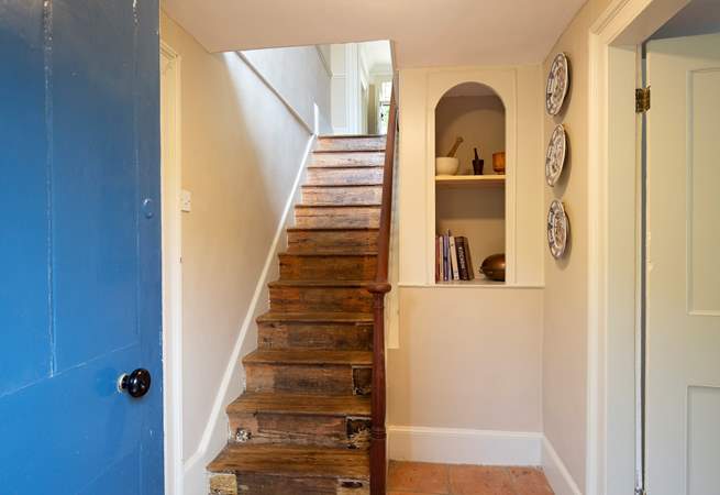 Stairs lead down to the kitchen and dining-room.