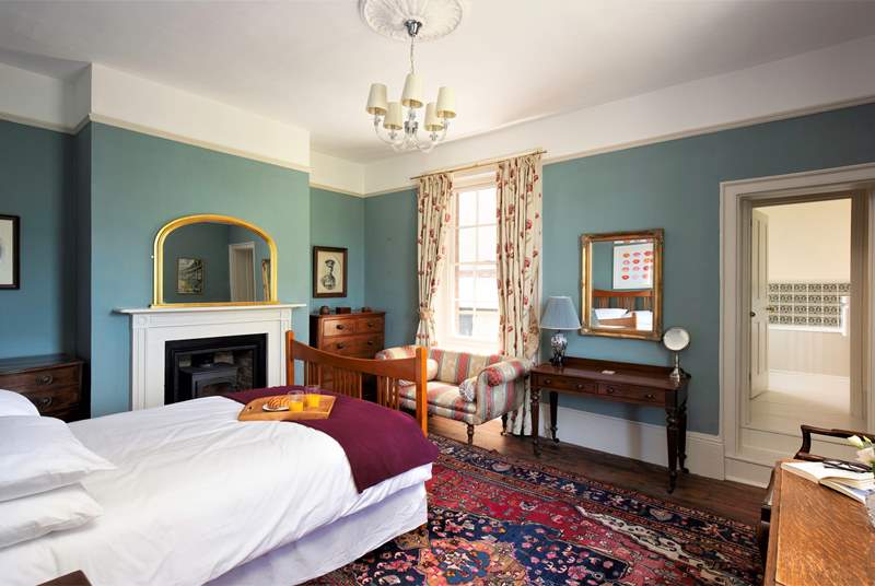 This bedroom is spacious and has a wealth of period features. 
Steps lead to the en suite bathroom.