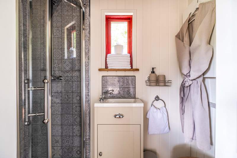 The en suite shower-room is so stylish. 