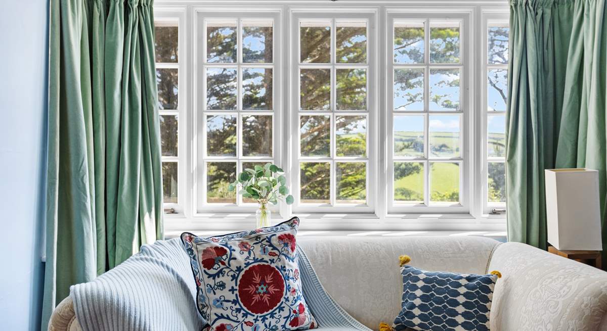 The sitting-room with views across the valley and beyond. 