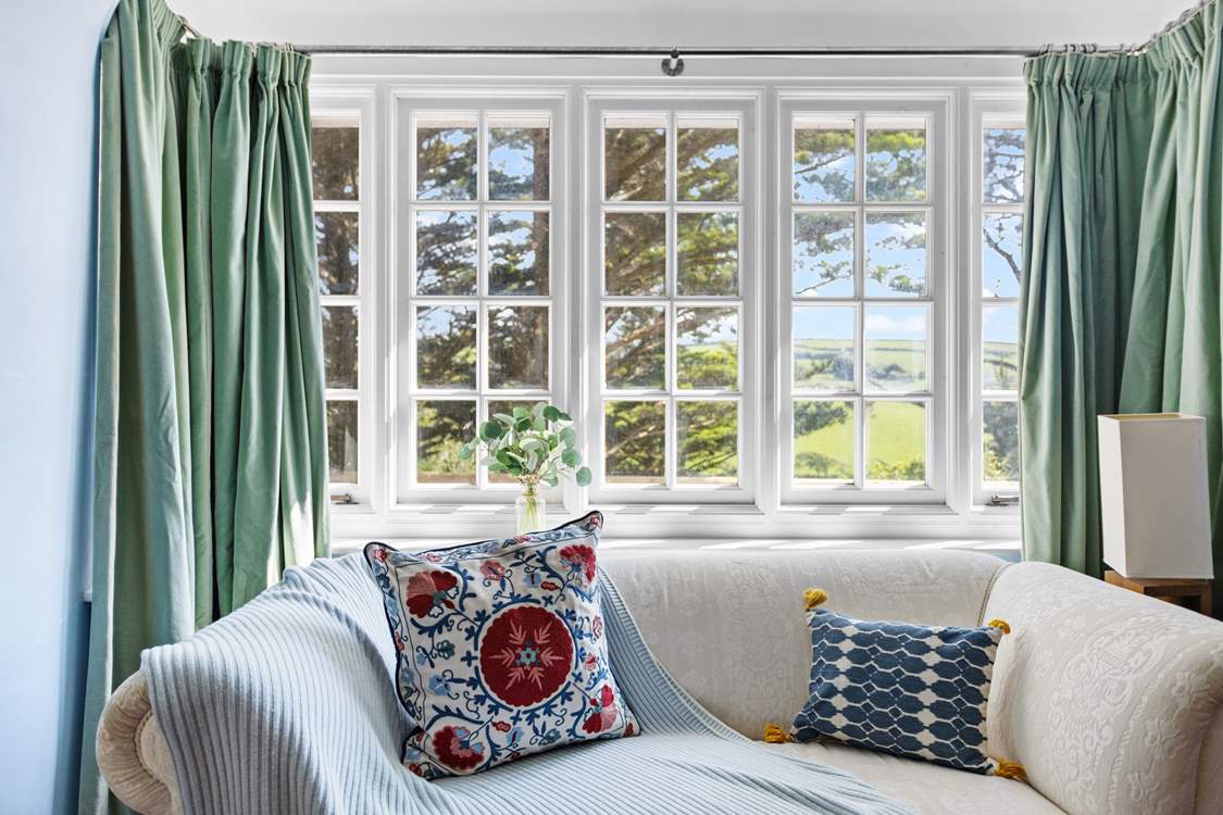 The sitting-room with views across the valley and beyond.