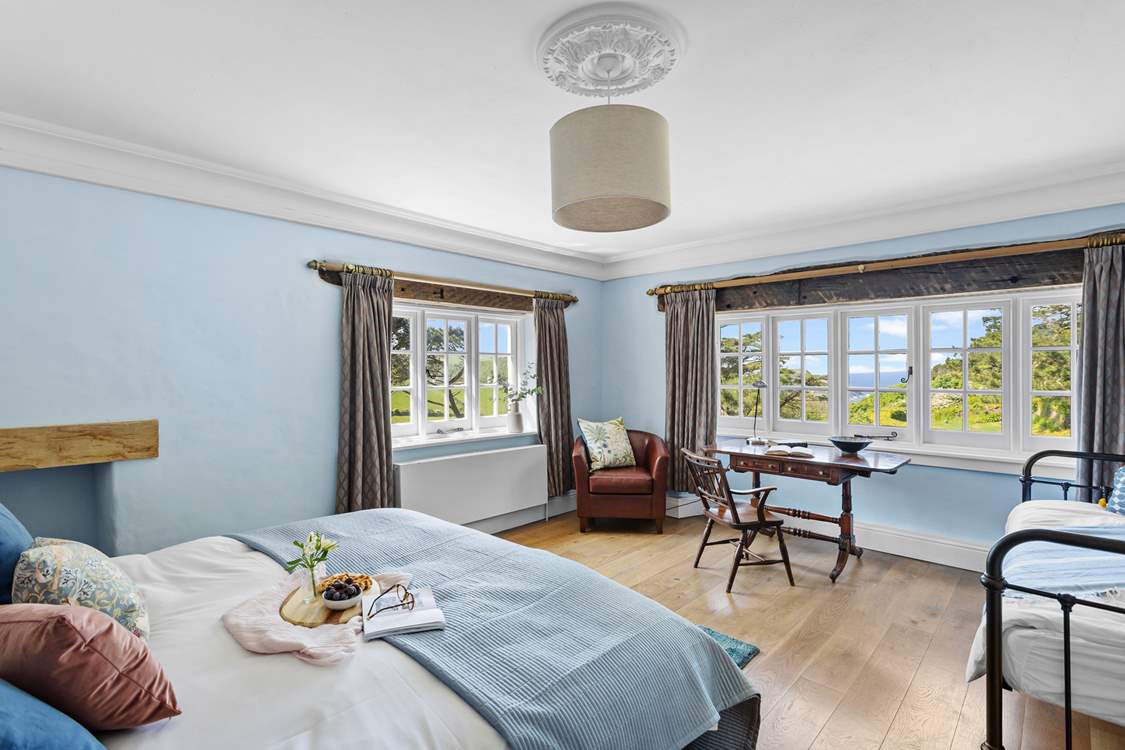 Bedroom 2 offers the perfect family room with a king-size double bed, a single day bed and of course the view!