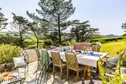 Al fresco dining with far reaching views to the sea.