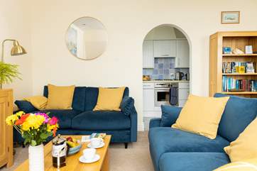 The kitchen is through the archway.