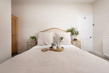 Bedroom 1 is a very pretty king room.