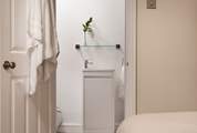 Bedroom 1 has an en suite shower-room.