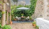 The idyllic top patio is a fantastic spot for evening drinks. Please supervise children as behind the white wall is the flat roof of the utility-room.  - Thumbnail Image