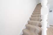 The stairs are true to the character of the cottage and narrow.