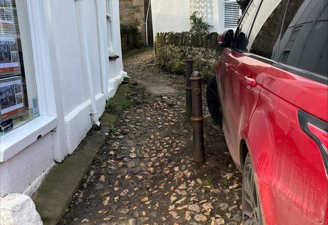 There is a cobbled path that leads to the entrance of No 7 Churchtown. 