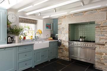 The gorgeous shaker style kitchen has a range cooker.