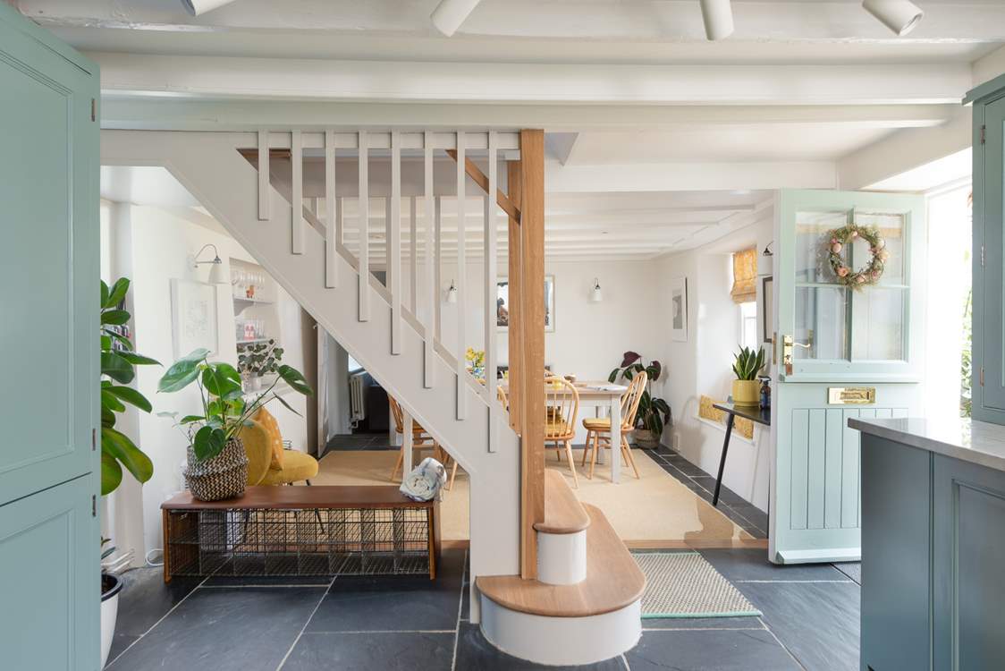 The staircase divides the dining area and the kitchen. As is typical in traditional cottages, the stairs are quite steep.