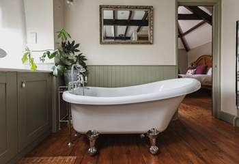 The elegant bath in the family bathroom is perfect for a long soak after a busy day. It's also accessed from Bedroom 3.
