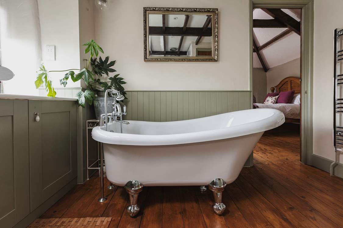 The elegant bath in the family bathroom is perfect for a long soak after a busy day. It's also accessed from Bedroom 3.