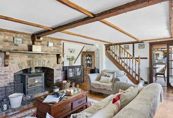The sitting-room has comfy sofas and traditional features and that all important wood-burner.