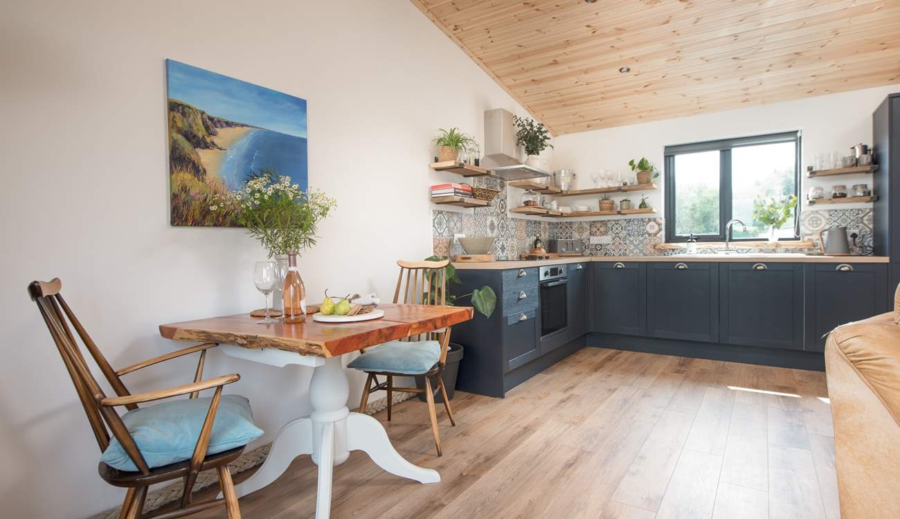 The delightful open plan living space is beautifully styled.