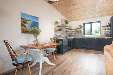 The delightful open plan living space is beautifully styled.