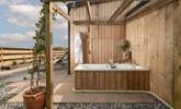 Relax in the outside bathtub. - Thumbnail Image