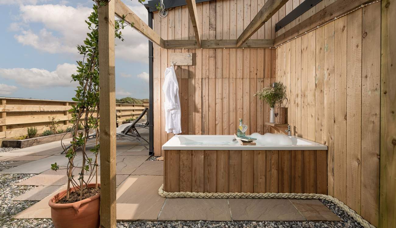 Relax in the outside bathtub.