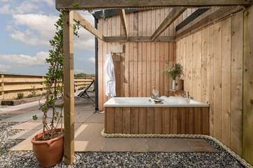Relax in the outside bathtub.