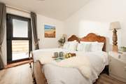The gorgeous bedroom has a fabulous super-king bed for a restful nights sleep.