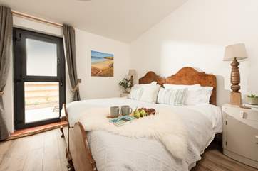 The gorgeous bedroom has a fabulous super-king bed for a restful nights sleep.