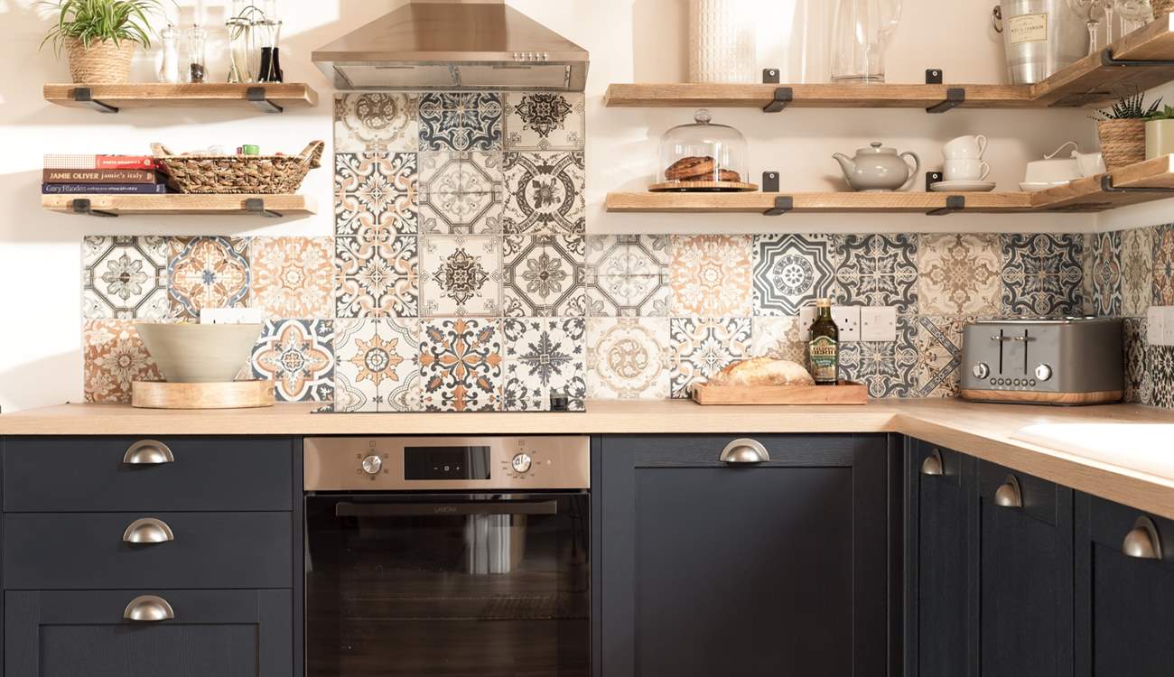 The kitchen area is oh so cute.