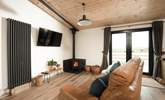 Snuggle up in the sitting area and feel the warmth from the wood-burner.  - Thumbnail Image