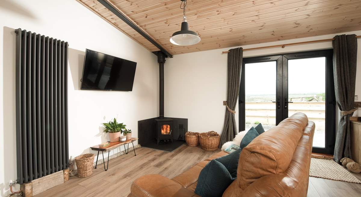 Snuggle up in the sitting area and feel the warmth from the wood-burner. 