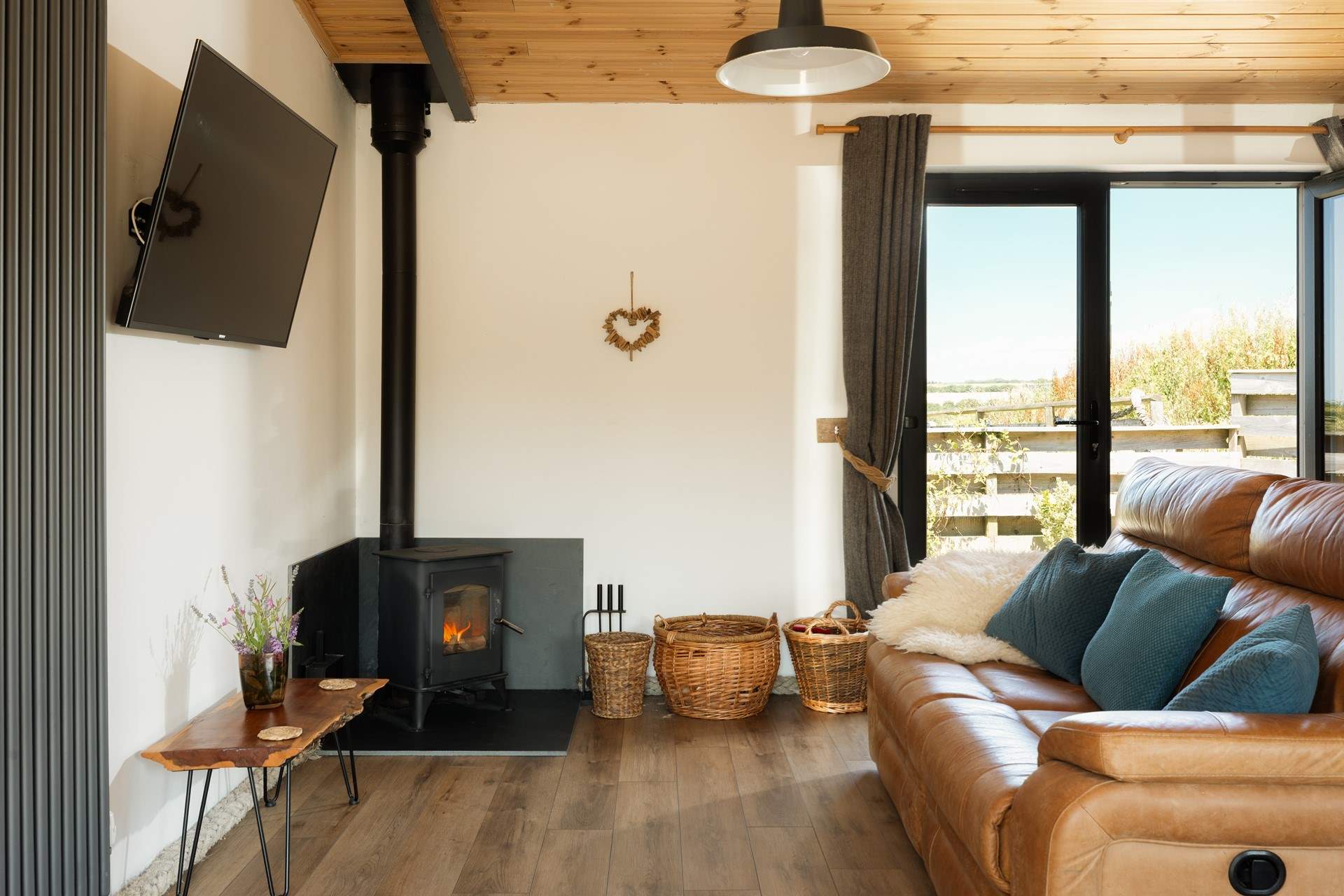 On cooler days, unwind beside the wood burner. 