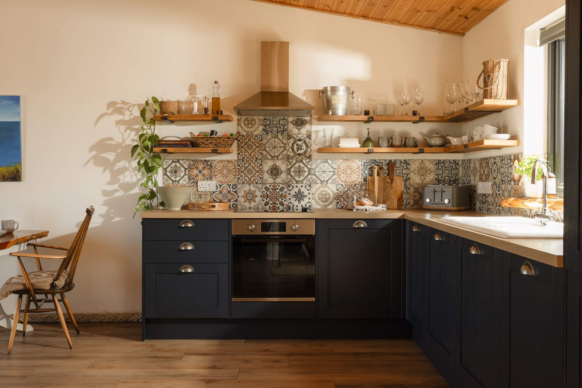The bohemian-style kitchen is equipped with everything you'll need. 