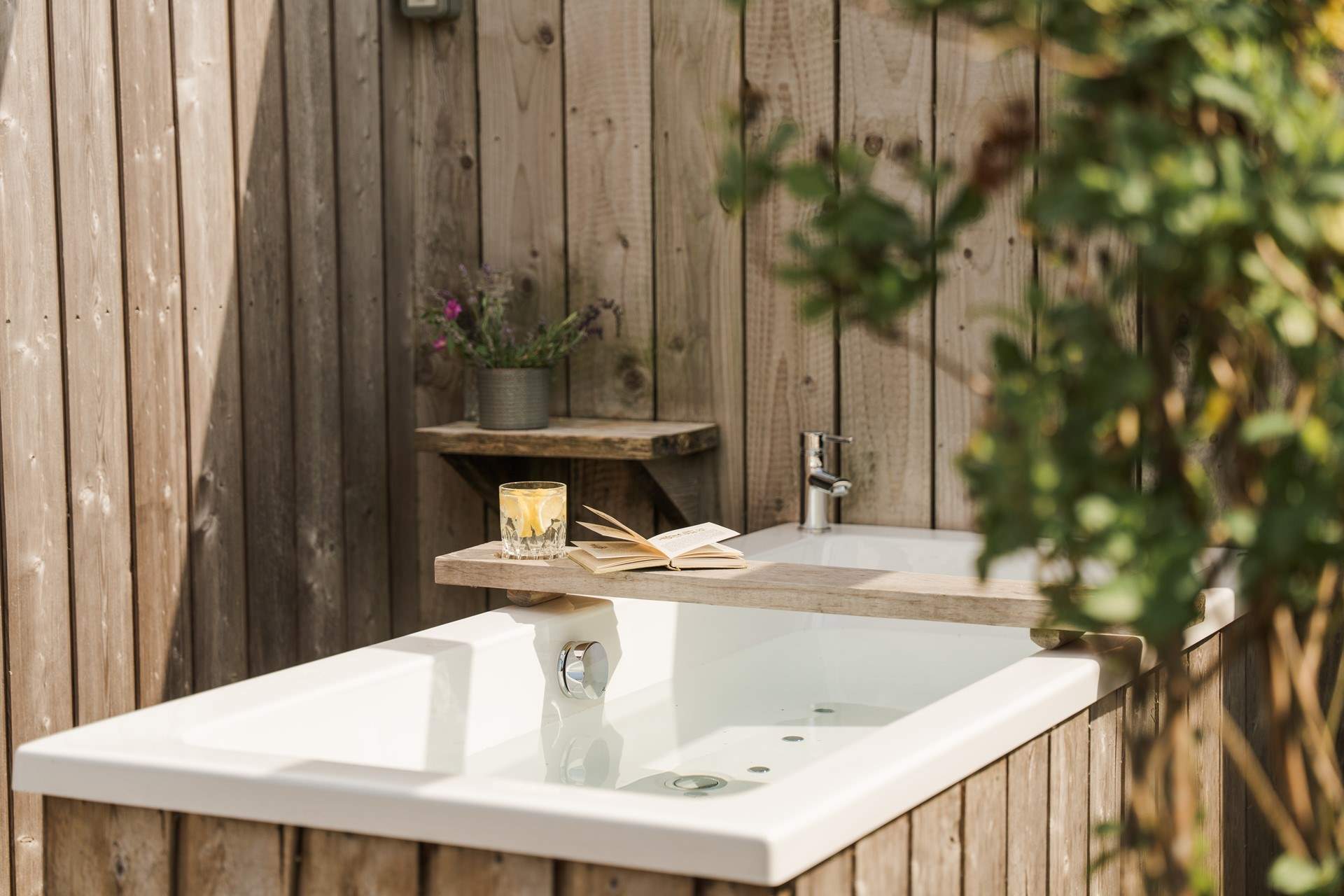 This woodclad hideout has a dreamy outdoor bathtub. 
