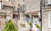 With its welcoming green door, the cottage can be found in a quiet setting close to the centre of Wells. - Thumbnail Image