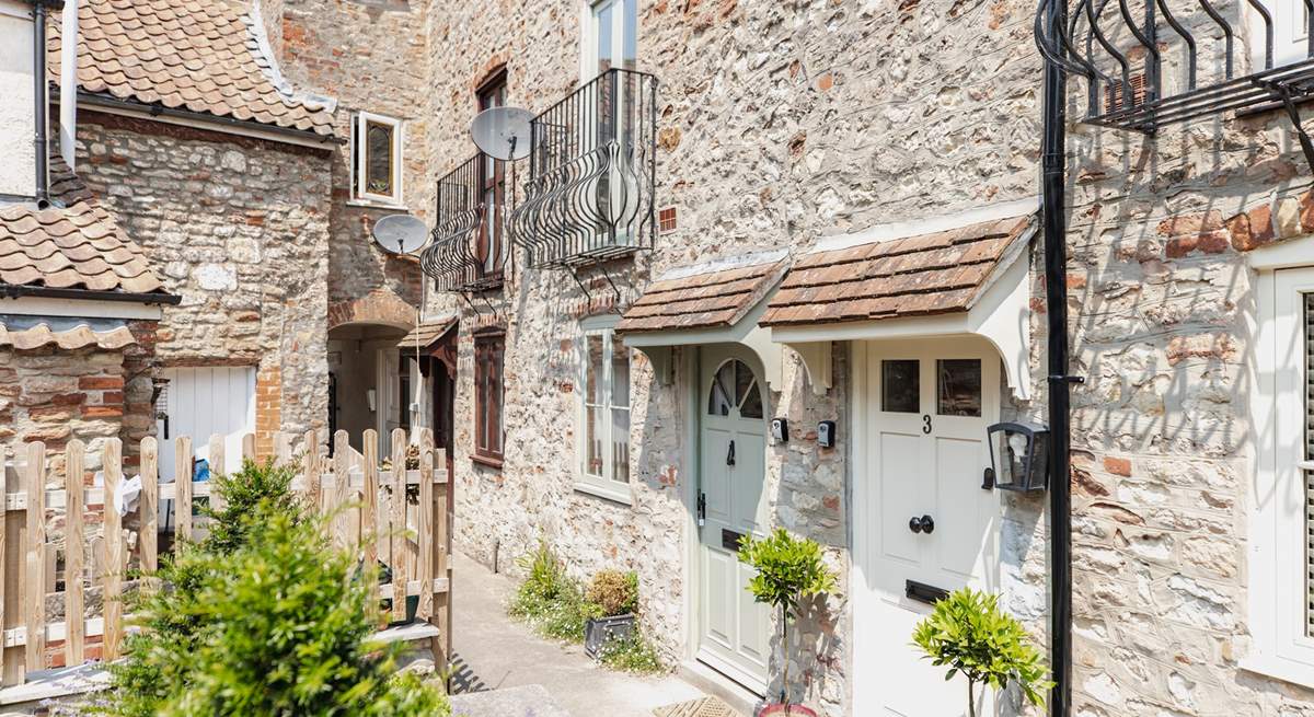 With its welcoming green door, the cottage can be found in a quiet setting close to the centre of Wells.