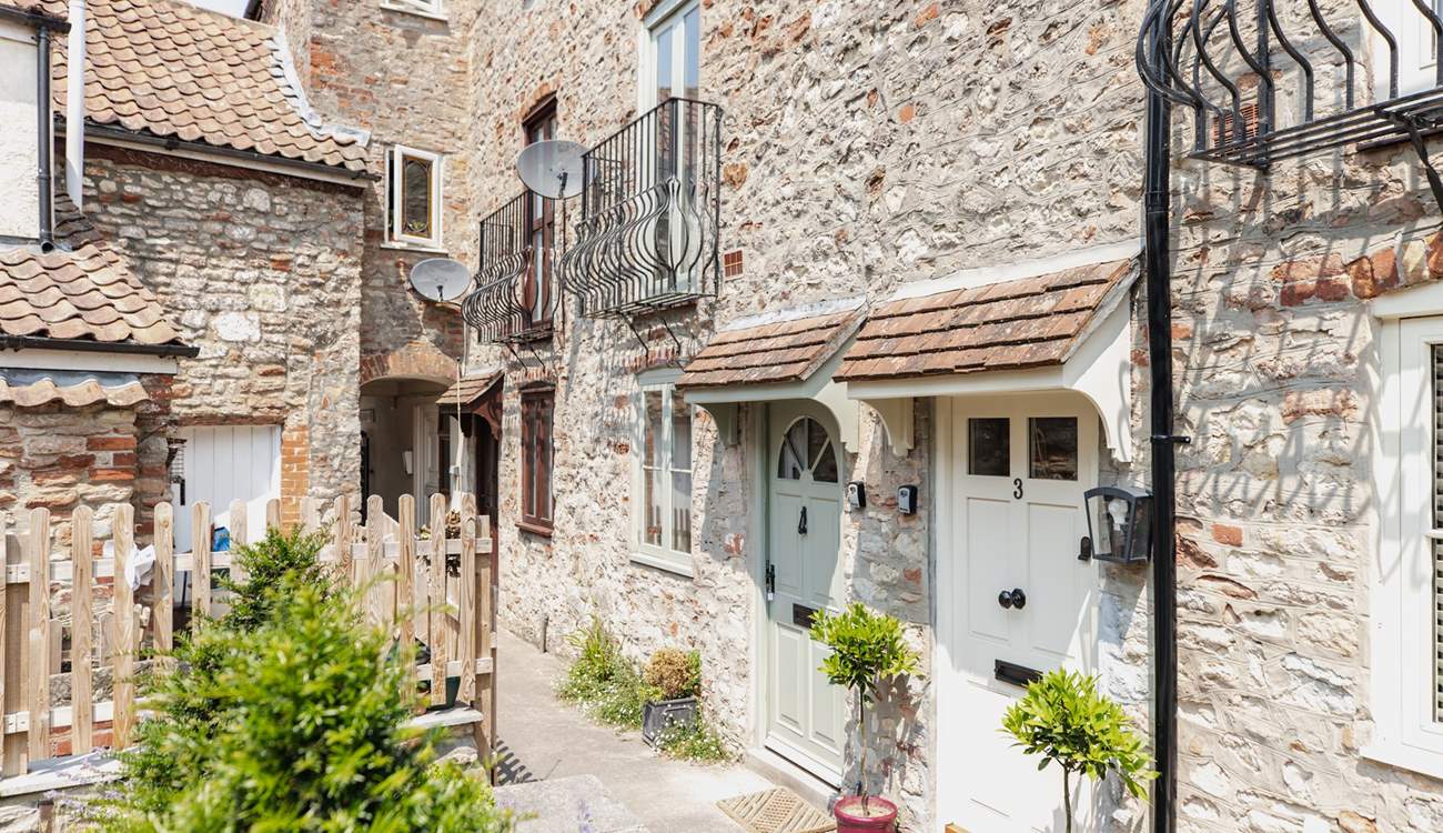 With its welcoming green door, the cottage can be found in a quiet setting close to the centre of Wells.