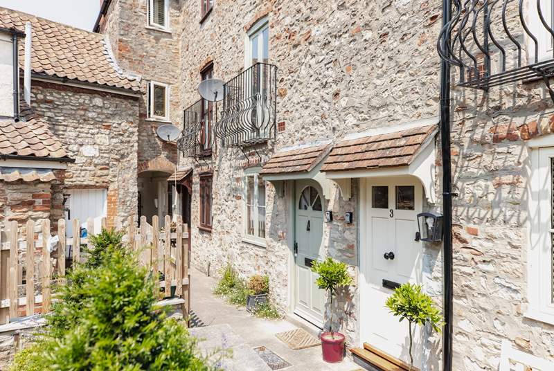 With its welcoming green door, the cottage can be found in a quiet setting close to the centre of Wells.