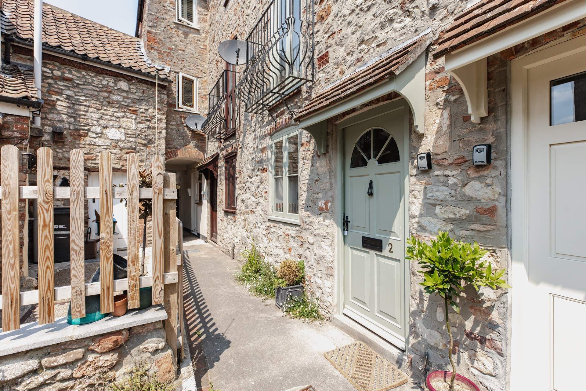 With its welcoming green door, the cottage can be found in a quiet setting close to the centre of Wells.