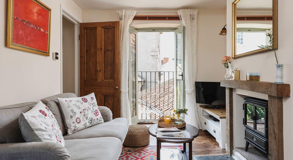 The Juliet balcony adds light to the pretty sitting-room.