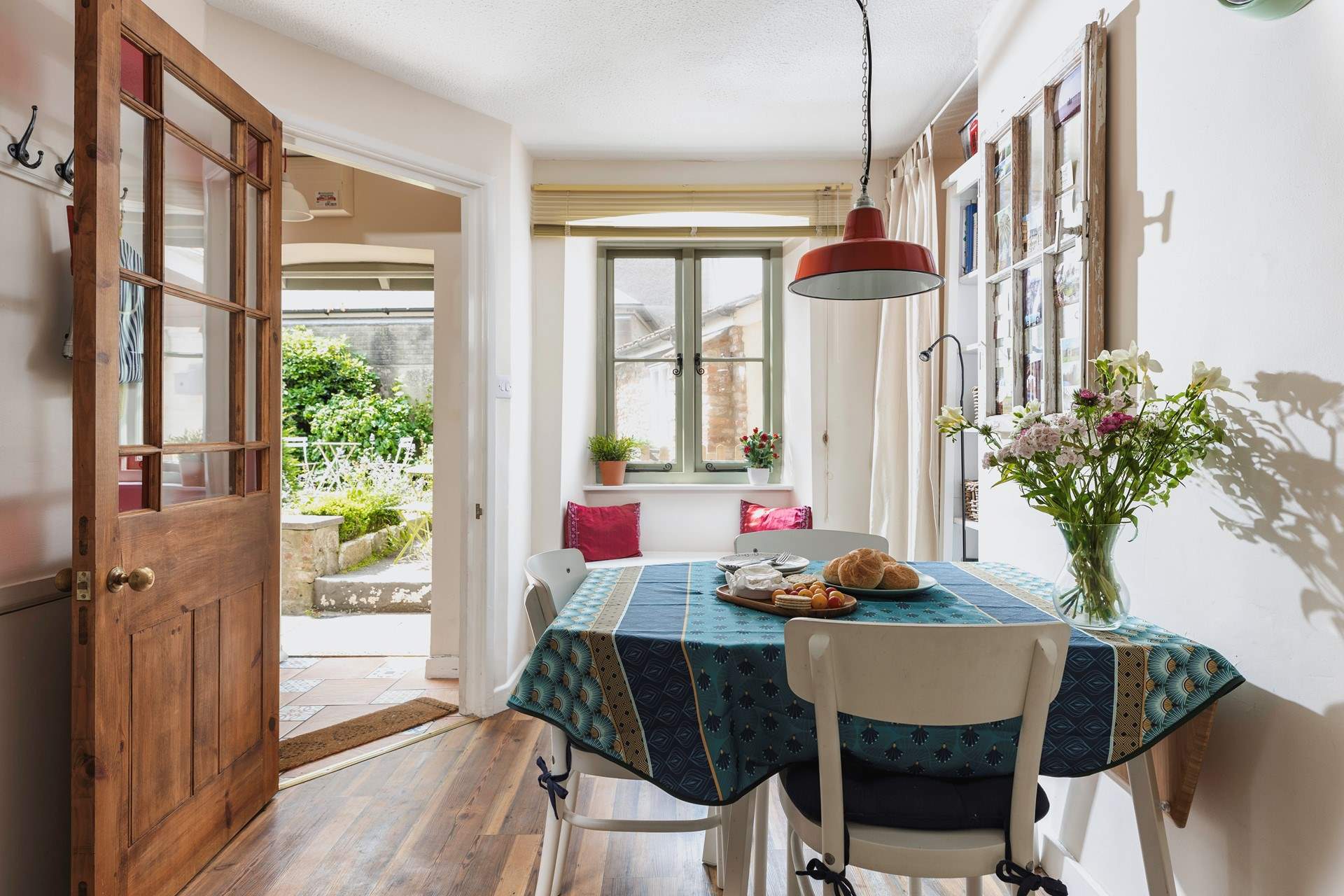 The kitchen and dining area is on the ground floor with the small seating area just outside the door.