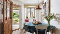The kitchen and dining area is on the ground floor with the small seating area just outside the door.
